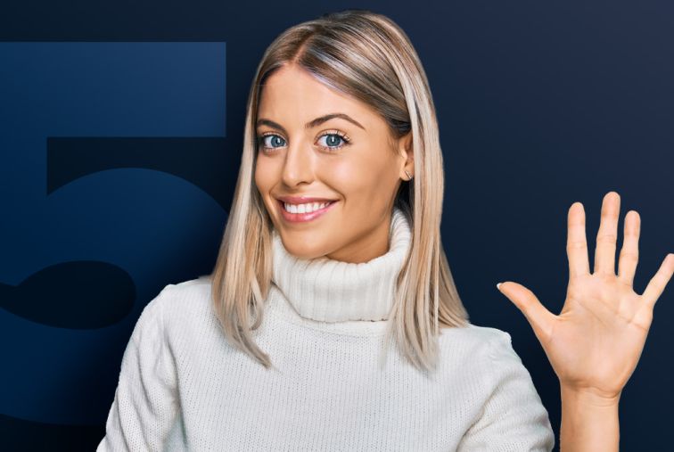 Person holding up five fingers in front of a large number 5.