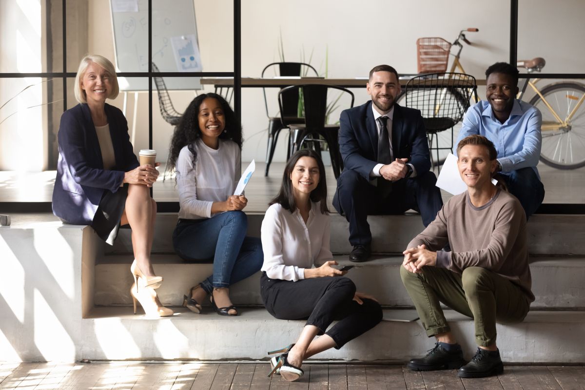 Coworkers on Couch Smiling